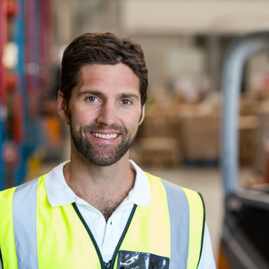 Portrait of smiling warehouse worker